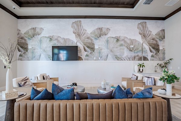 Clubhouse with elegant design and cozy seating at Eden Heritage Lakes Apartments