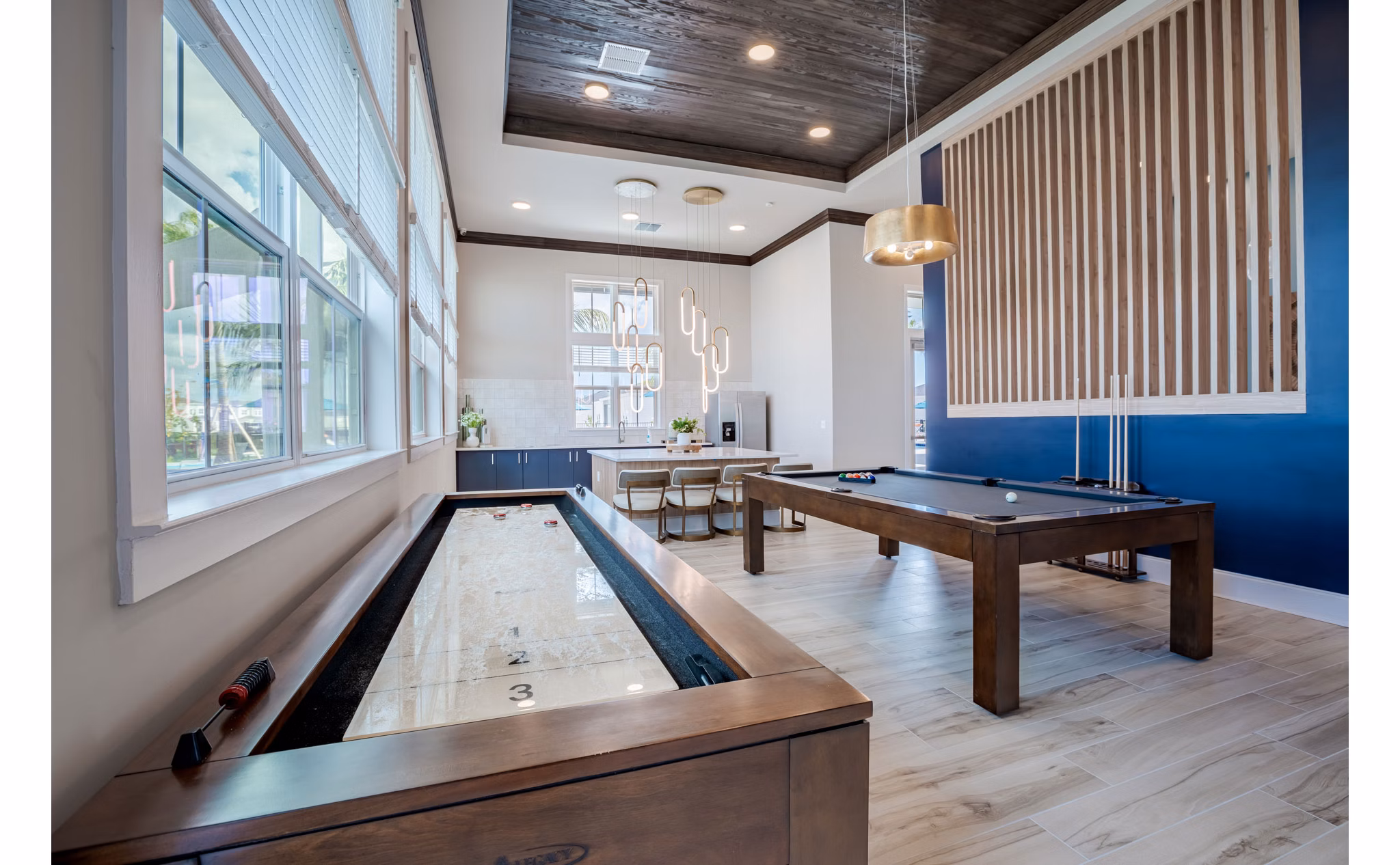 Game room with billiards table and lounge seating at Eden Heritage Lakes Apartments