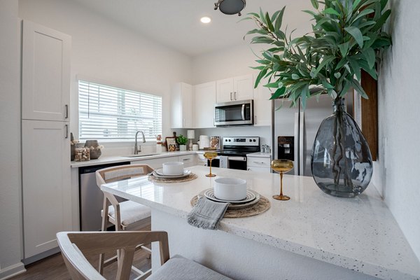Elegant dining area with modern furnishings at Eden Heritage Lakes Apartments