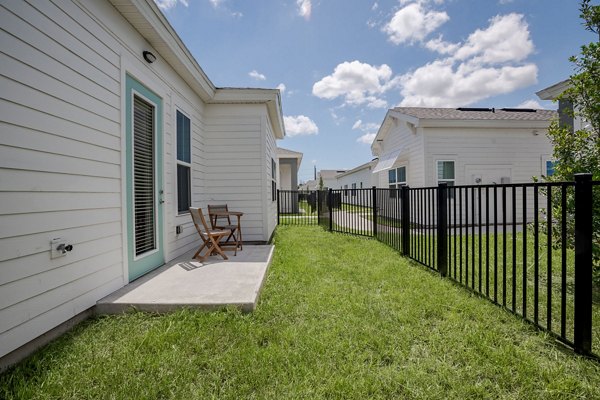 Eden Heritage Lakes Apartments: Modern patio space featuring comfortable seating and lake views