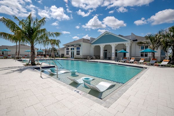 Bay Court at Eden Heritage Lakes: Luxurious pool with lounge seating at Greystar luxury apartments