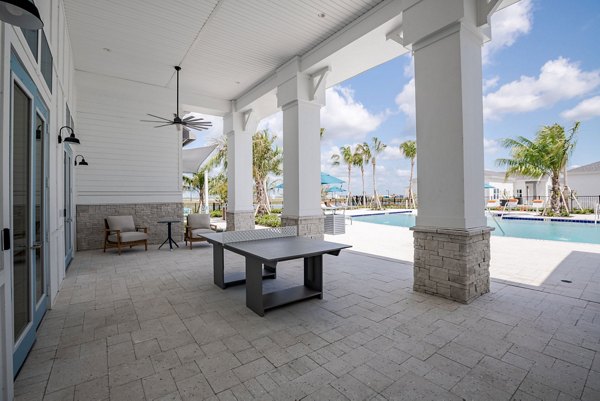 Outdoor patio with cozy seating at Eden Heritage Lakes Apartments
