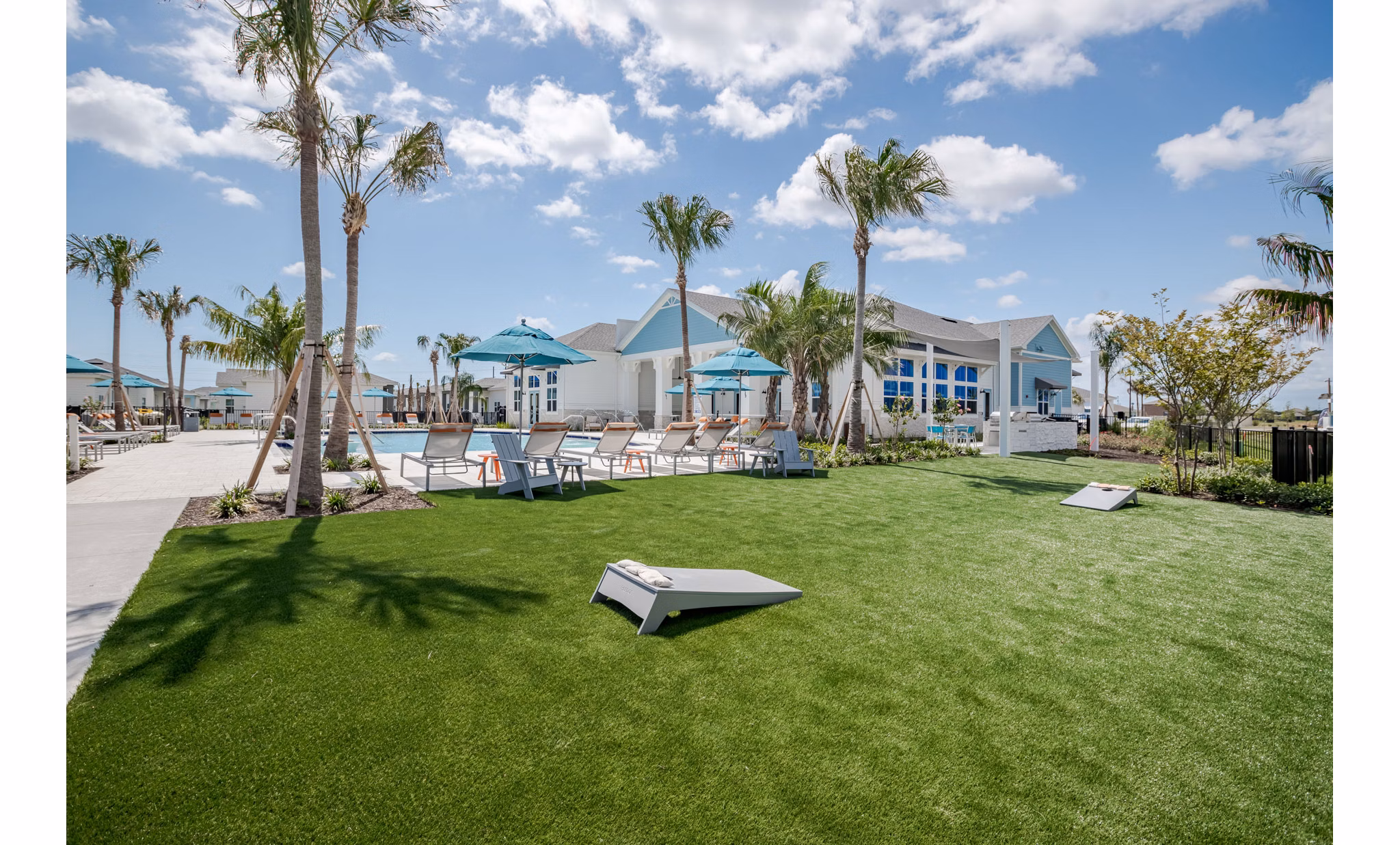 Courtyard featuring lush landscaping and seating areas at Eden Heritage Lakes Apartments