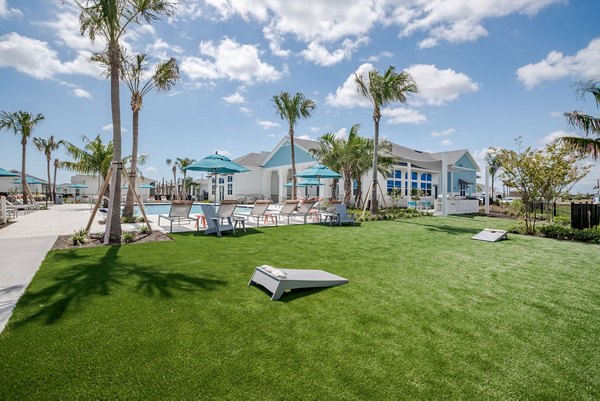Courtyard featuring lush landscaping and seating areas at Eden Heritage Lakes Apartments