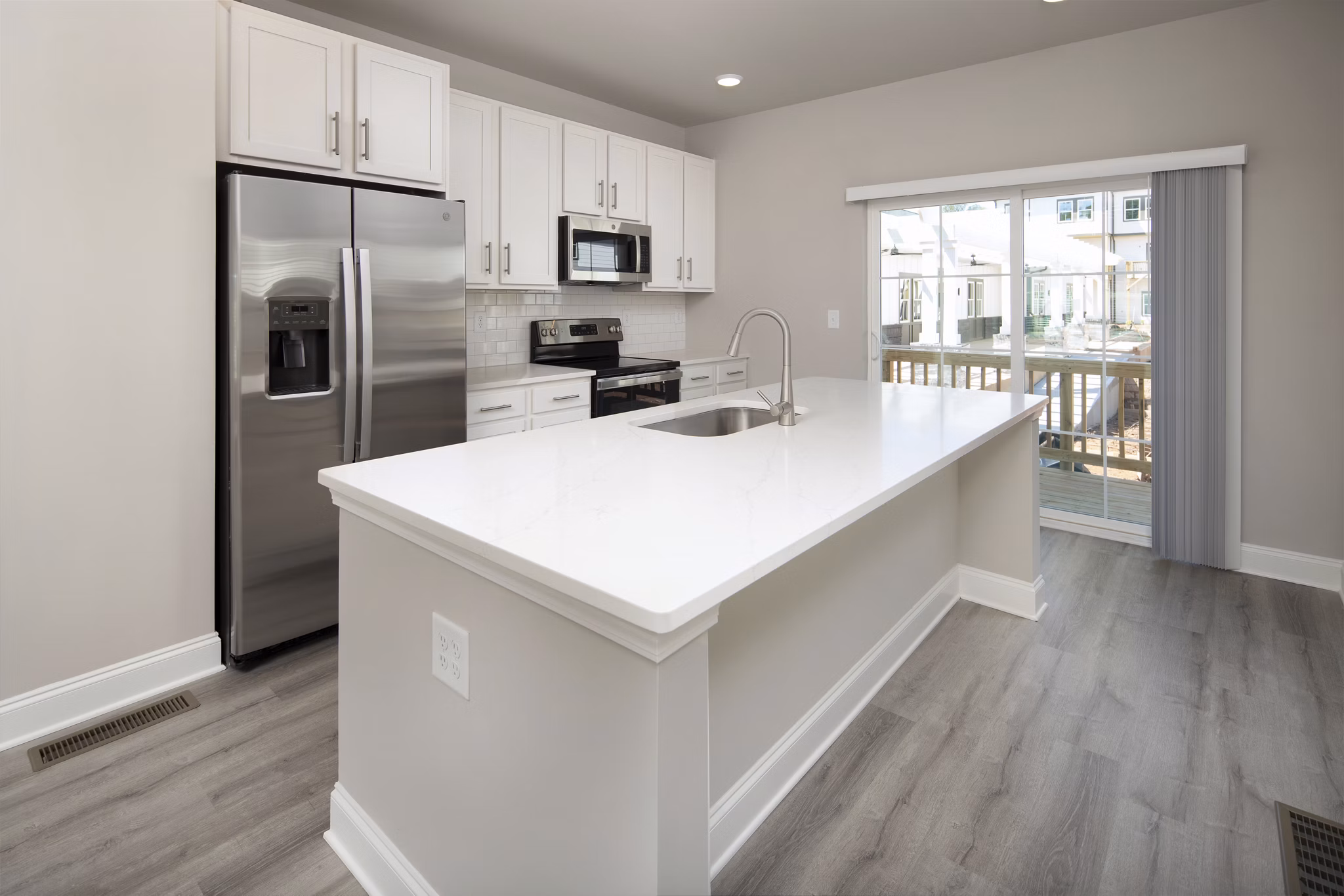 Modern kitchen with stainless steel appliances in Generation Avondale East Apartments