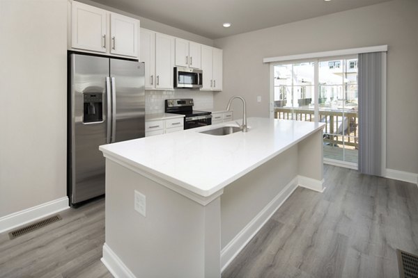 Modern kitchen with stainless steel appliances in Generation Avondale East Apartments