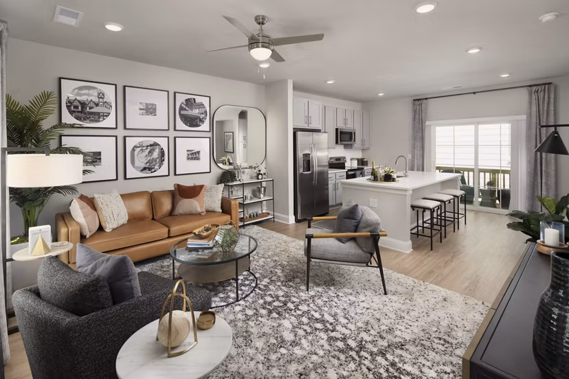 Living room with modern decor and large windows in Generation Avondale East Apartments