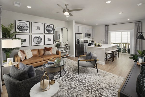 Living room with modern decor and large windows in Generation Avondale East Apartments