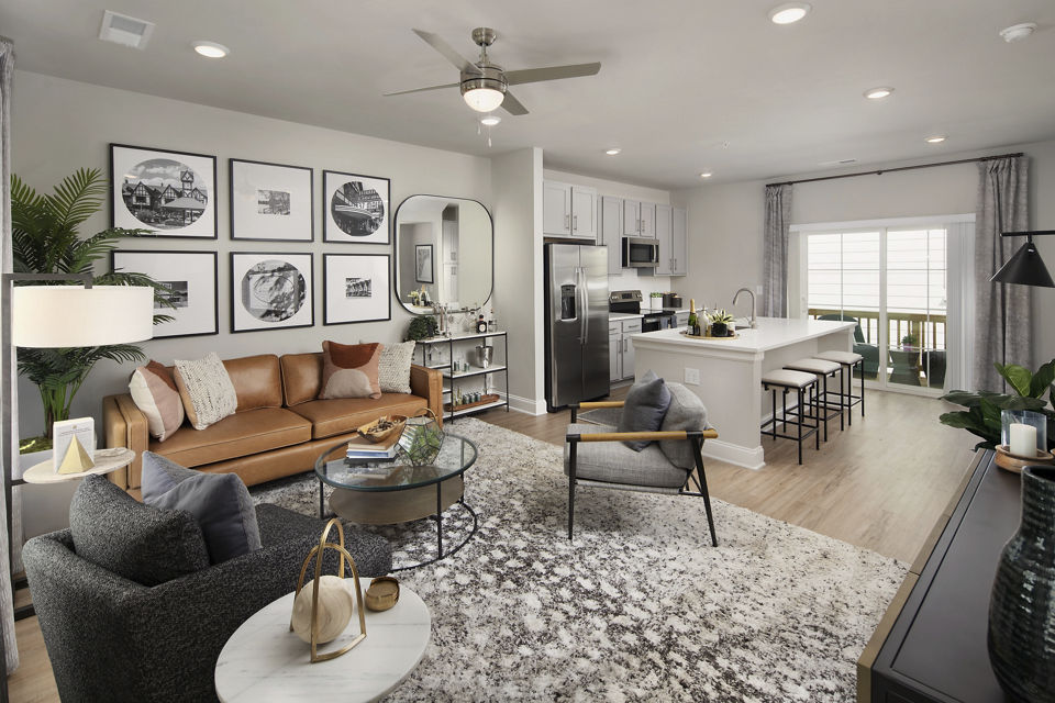 Living room with modern decor and large windows in Generation Avondale East Apartments
