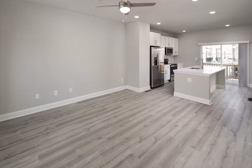 Spacious living room with sleek furniture and modern decor in Generation Avondale East Apartments