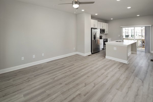 Spacious living room with sleek furniture and modern decor in Generation Avondale East Apartments