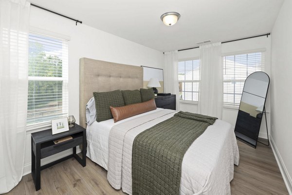 Cozy bedroom with modern furniture at Affinity at Hudson Apartments