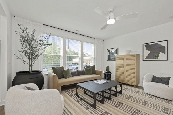 Modern living room with elegant decor at Affinity at Hudson Apartments