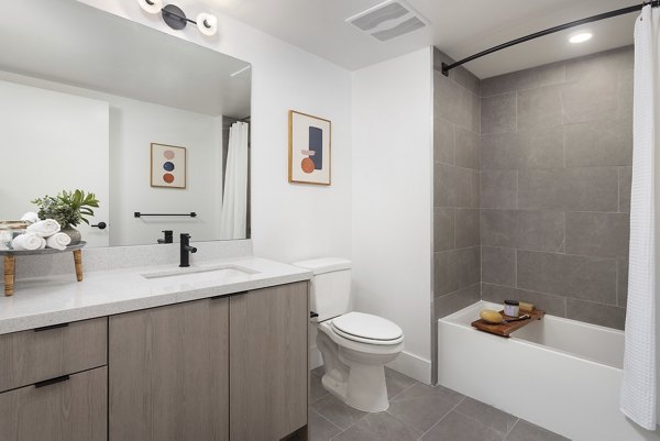Spacious bathroom with modern fixtures at The Charlie WeHo Apartments, offering luxury living in West Hollywood