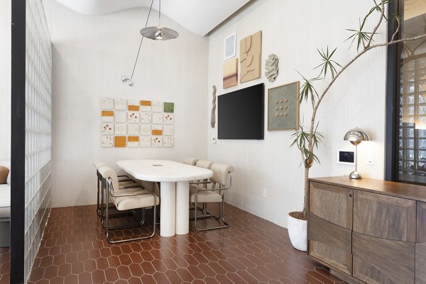 Clubhouse featuring modern decor and cozy seating at The Charlie WeHo Apartments, a luxury Greystar property in West Hollywood