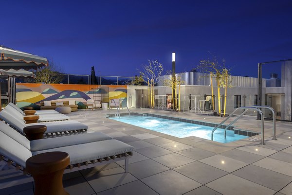 Scenic outdoor pool area at The Charlie WeHo Apartments, luxury living in West Hollywood