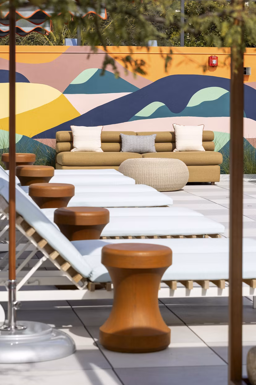 The Charlie WeHo Apartments: Scenic courtyard with lush landscaping and seating areas in West Hollywood luxury apartments