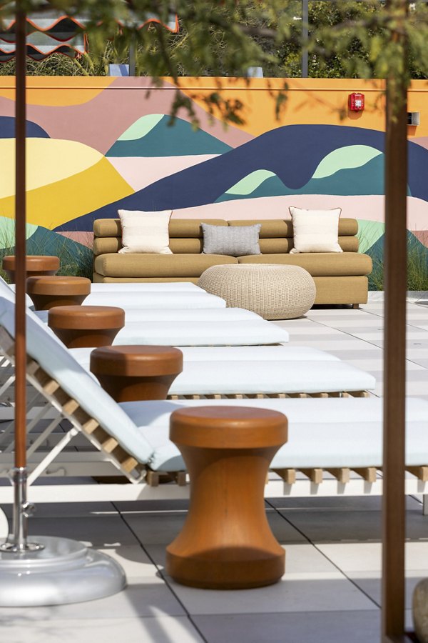 The Charlie WeHo Apartments: Scenic courtyard with lush landscaping and seating areas in West Hollywood luxury apartments