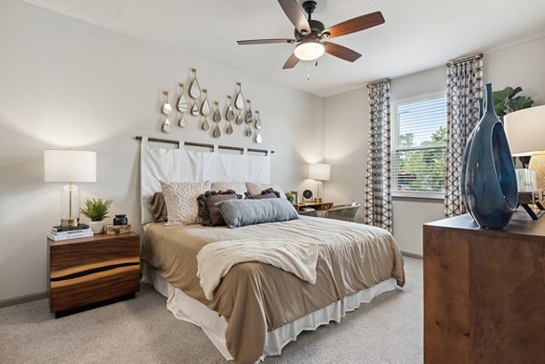 Cozy bedroom with modern decor at Riverchase Vista Apartments