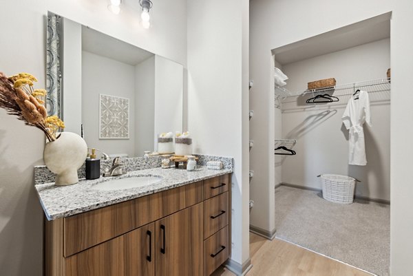Bathroom with modern fixtures and marble countertop at Riverchase Vista Apartments