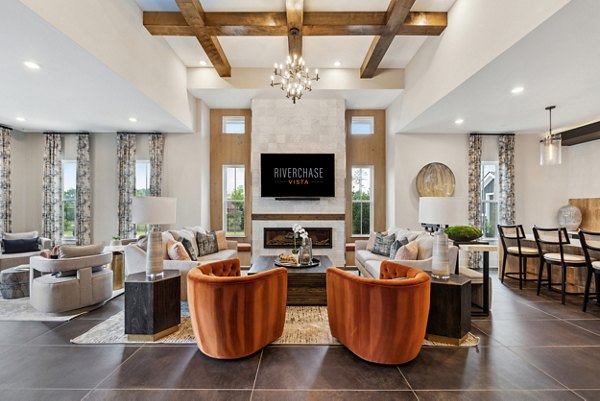 Clubhouse featuring modern design and lounge area at Riverchase Vista Apartments
