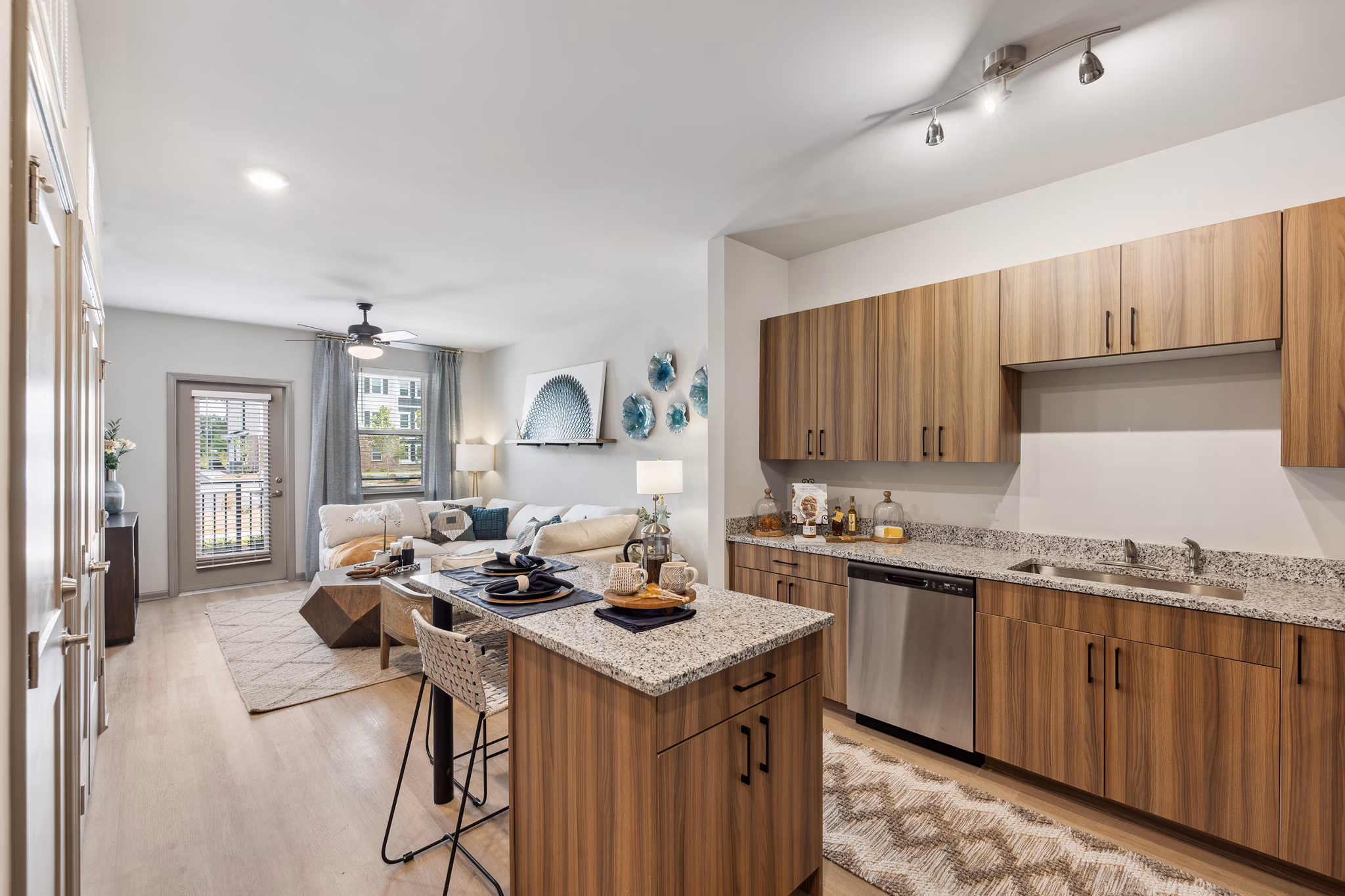 Modern kitchen featuring granite countertops and stainless steel appliances in Riverchase Vista Apartments