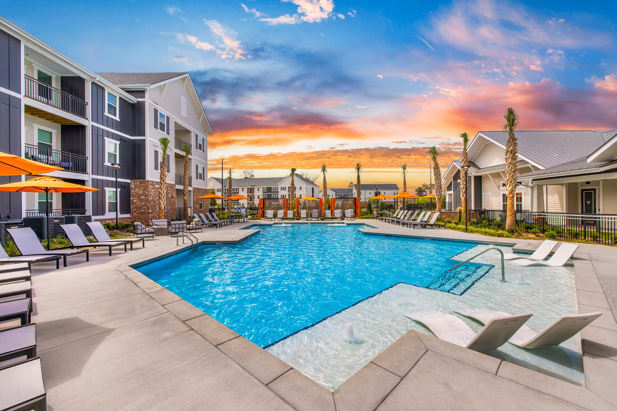 Relaxing pool at Riverchase Vista Apartments with lounge chairs and landscaped surroundings