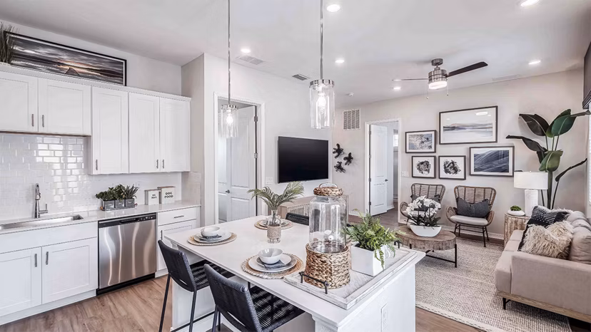 Modern kitchen with sleek countertops and stainless steel appliances at Yardly Artisan Lakes Homes apartments