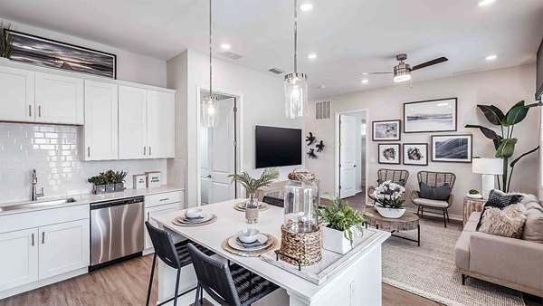 Modern kitchen with sleek countertops and stainless steel appliances at Yardly Artisan Lakes Homes apartments