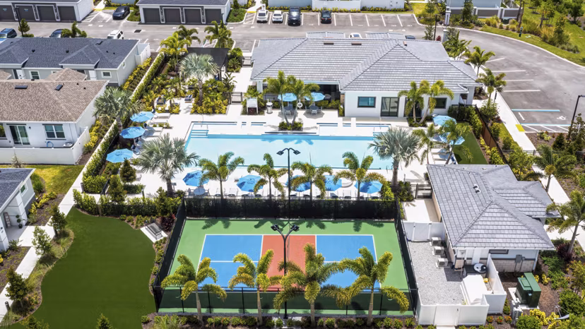 Scenic view at Yardly Artisan Lakes Homes featuring lush landscaping and serene water elements