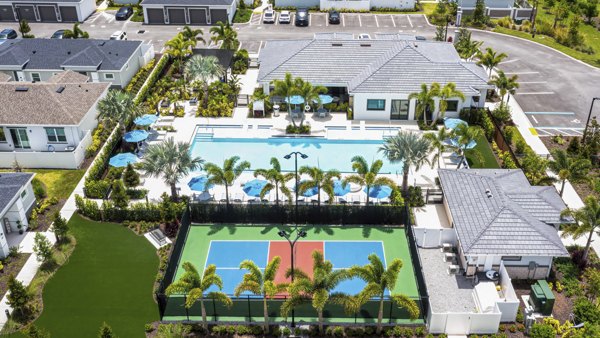 Scenic view at Yardly Artisan Lakes Homes featuring lush landscaping and serene water elements
