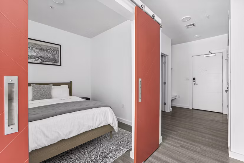 Modern bedroom with sleek furnishings at The Marek South Apartments