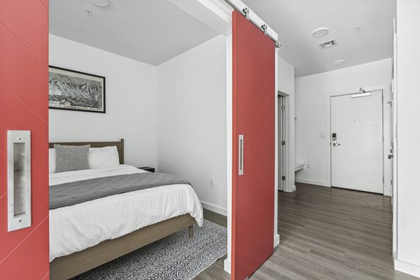 Modern bedroom with sleek furnishings at The Marek South Apartments