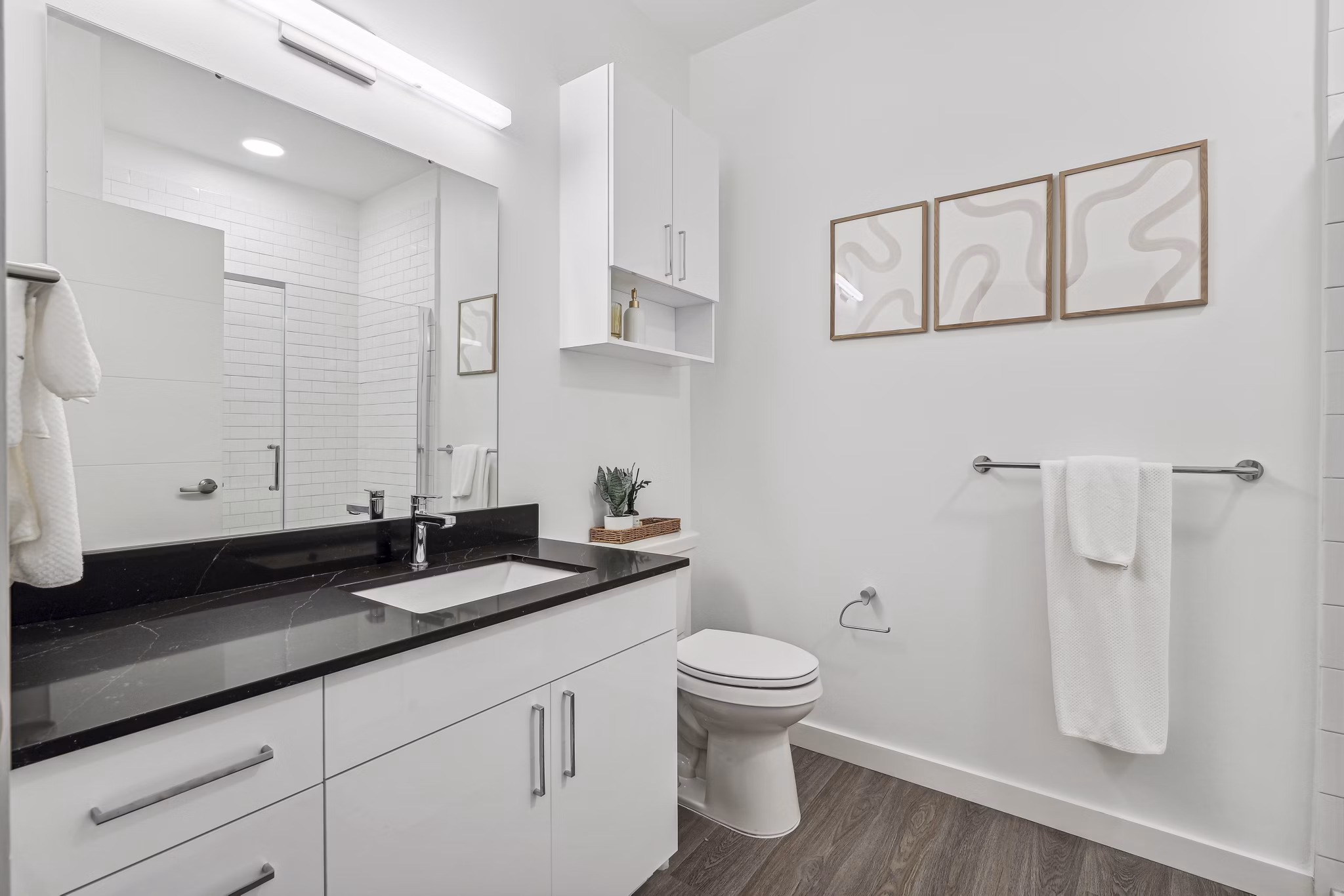 Modern bathroom with sleek fixtures at The Marek South Apartments, showcasing luxury amenities in a serene setting