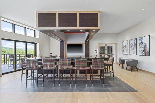 Clubhouse with modern design elements at The Marek South Apartments, offering luxury living and social spaces ideal for residents