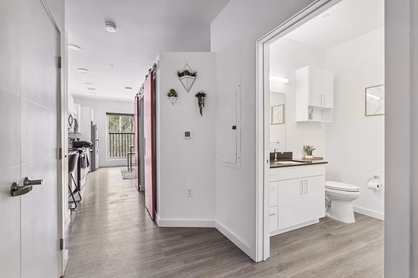 Chic hallway with modern lighting fixtures at The Marek South luxury apartments