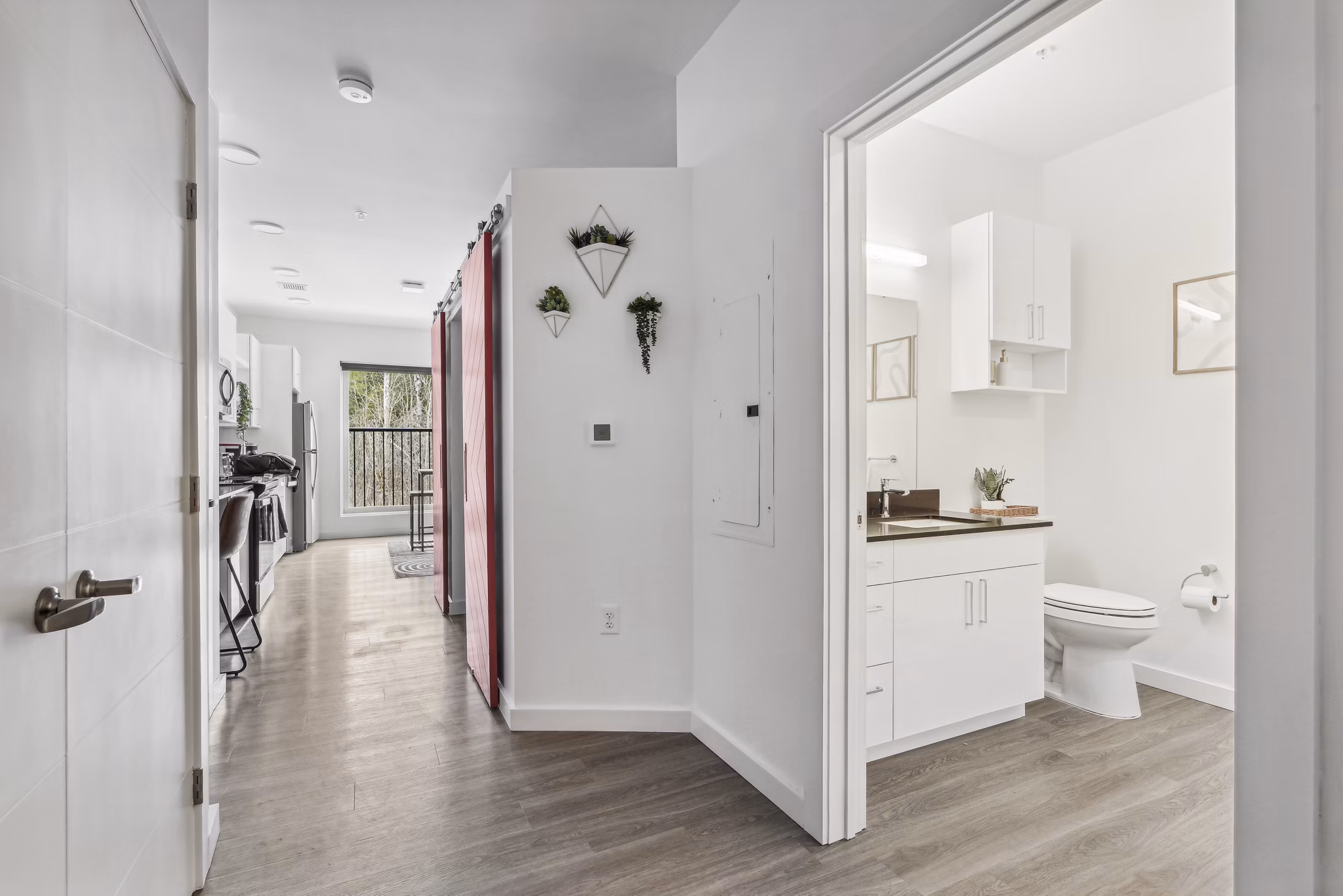 Chic hallway with modern lighting fixtures at The Marek South luxury apartments