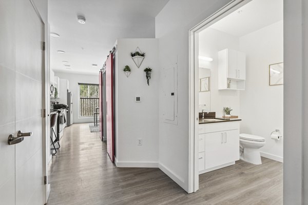 Chic hallway with modern lighting fixtures at The Marek South luxury apartments