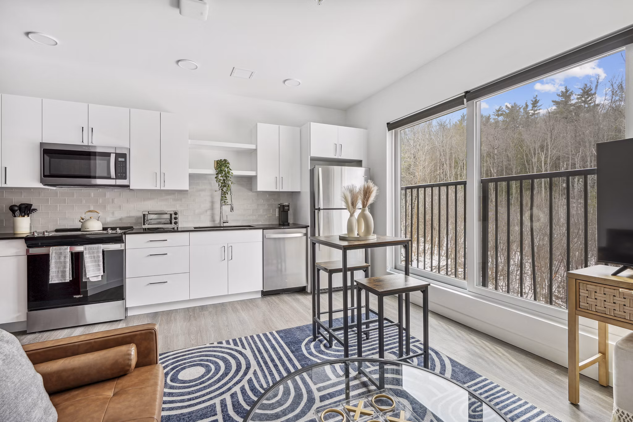 Modern kitchen with stainless steel appliances in The Marek South Apartments