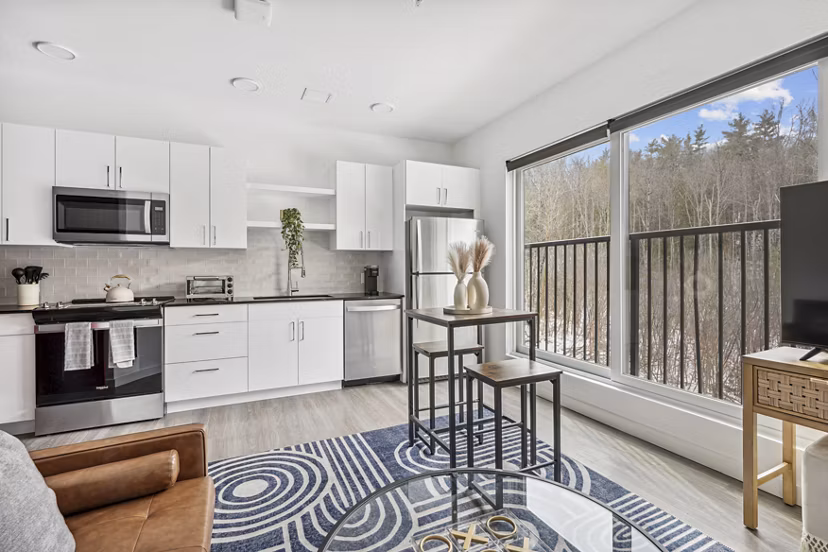 Modern kitchen with stainless steel appliances in The Marek South Apartments