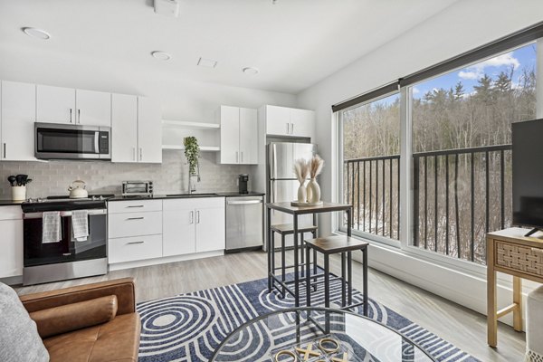 Modern kitchen with stainless steel appliances in The Marek South Apartments