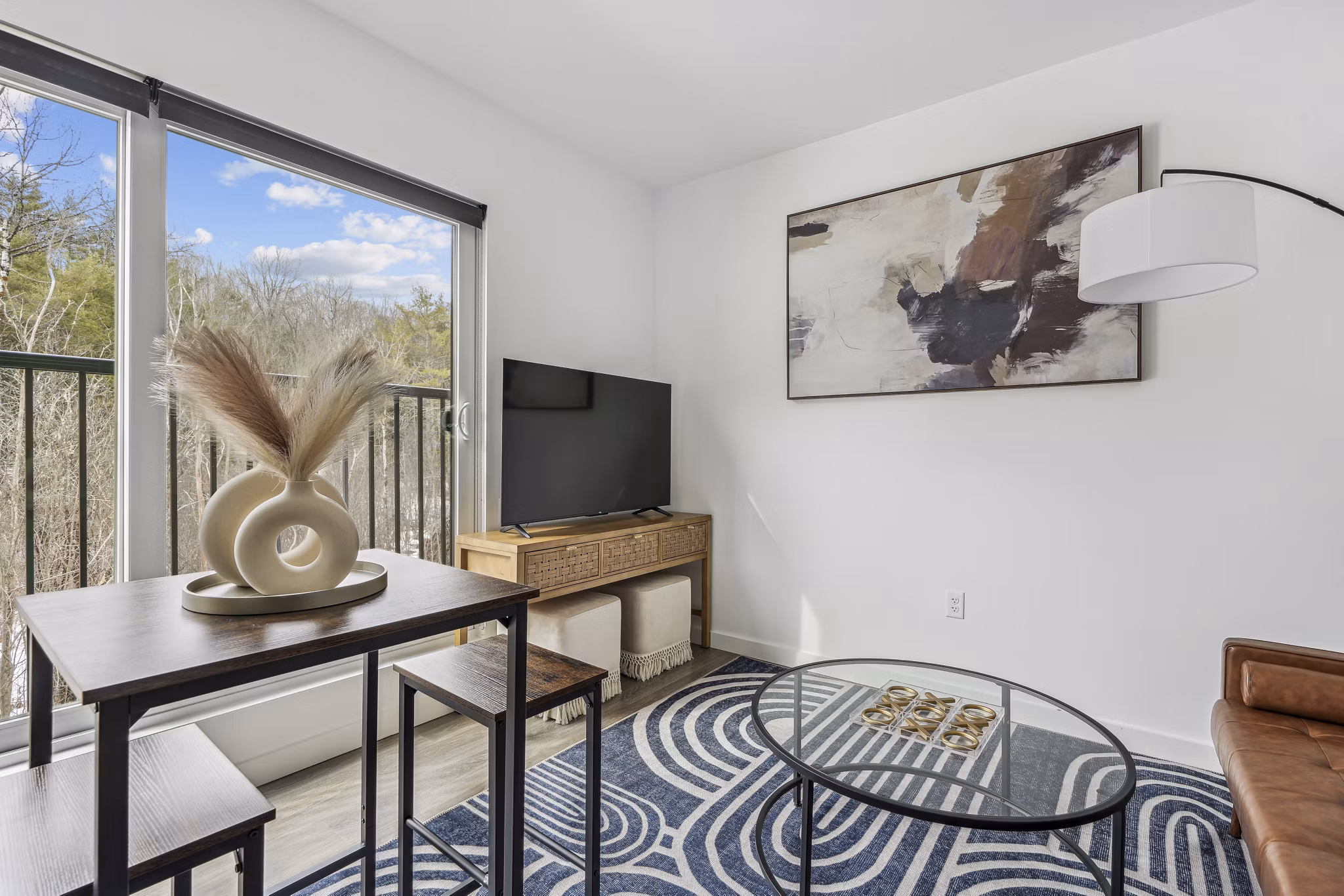 Living room at The Marek South Apartments featuring modern furniture and elegant design, offering luxury living in a prime location