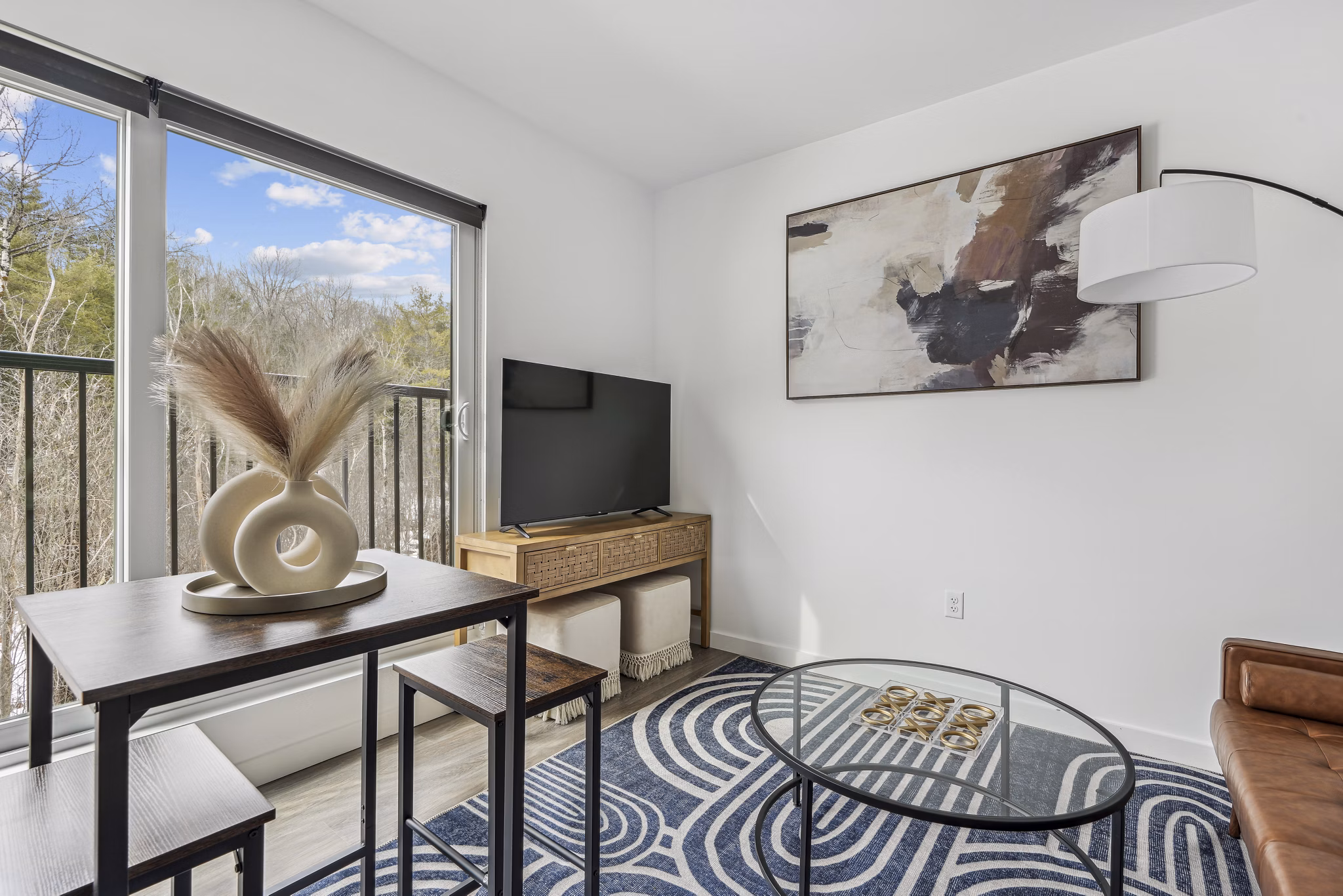 Living room at The Marek South Apartments featuring modern furniture and elegant design, offering luxury living in a prime location