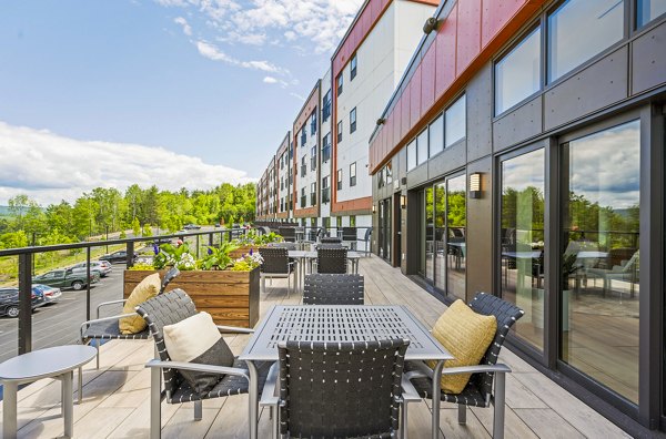 Cozy fire pit patio at The Marek South Apartments in luxury setting