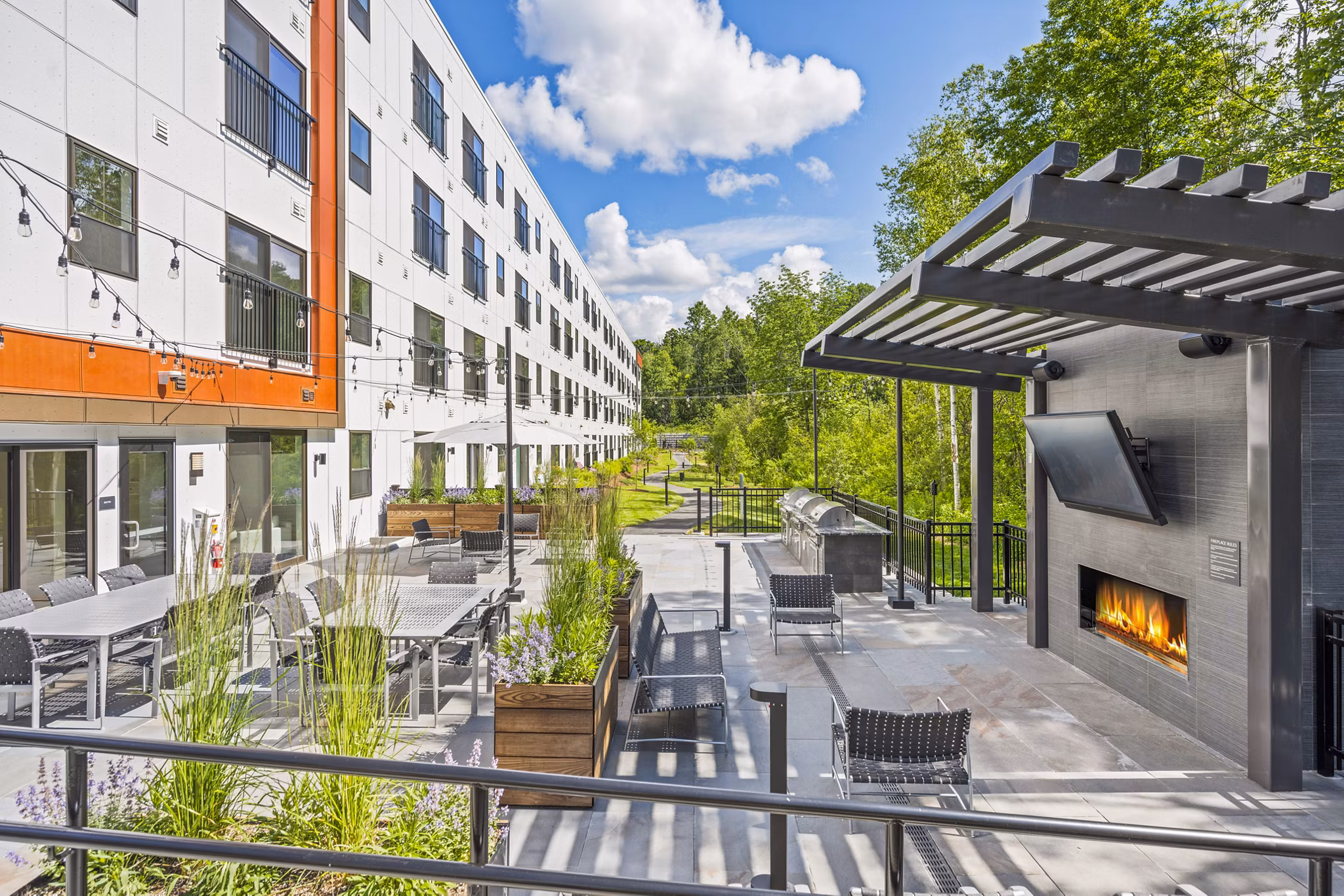 Cozy fire pit on the patio at The Marek South Apartments, offering a luxurious outdoor retreat for residents