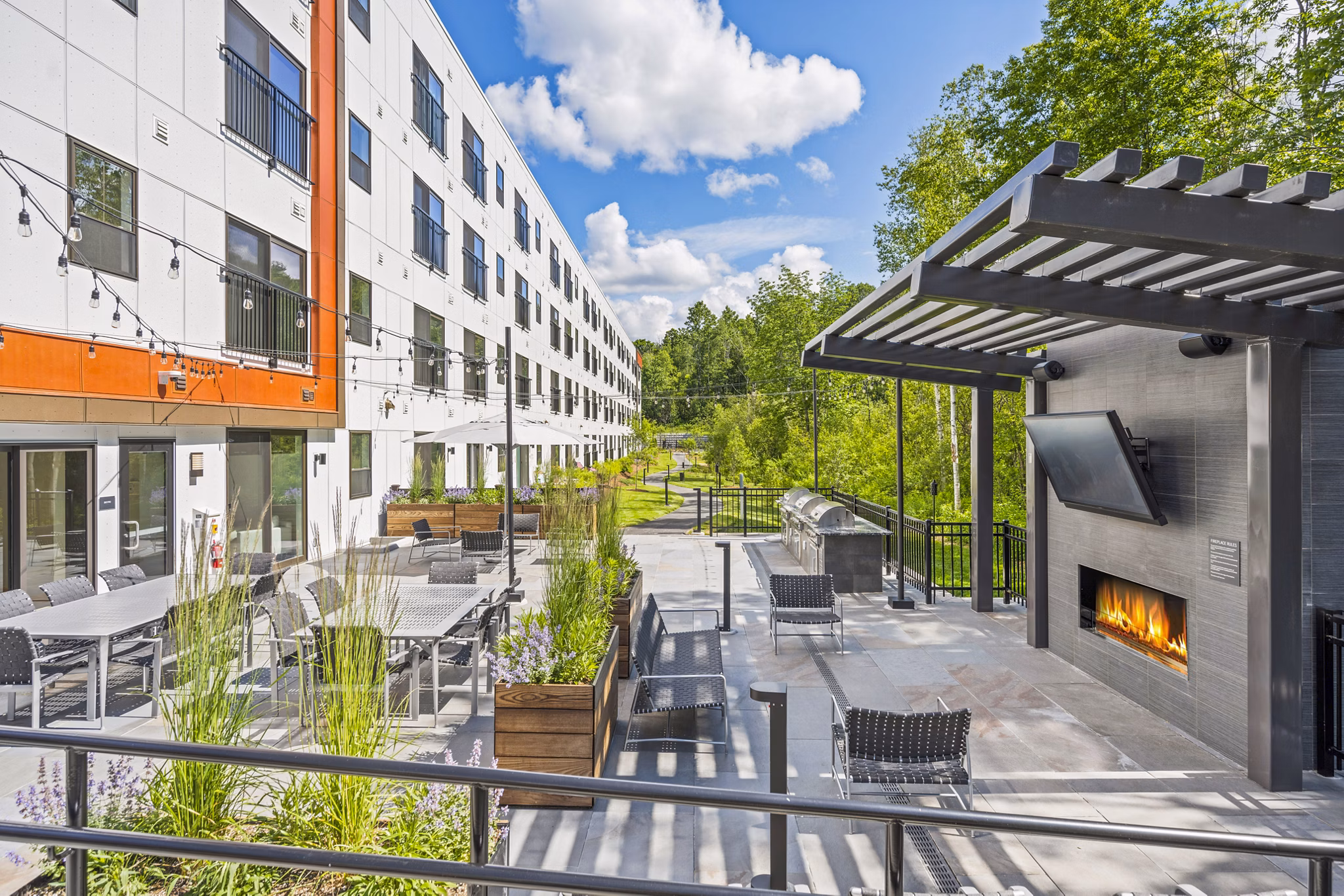 Cozy fire pit on the patio at The Marek South Apartments, offering a luxurious outdoor retreat for residents