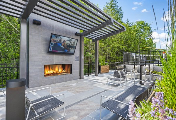Fire pit on patio at The Marek South Apartments with seating area for outdoor relaxation