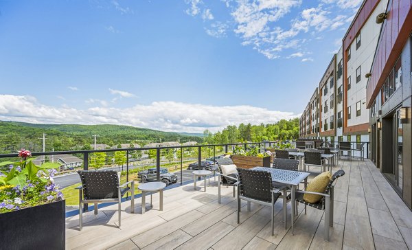 Fire pit on a stylish patio at The Marek South Apartments