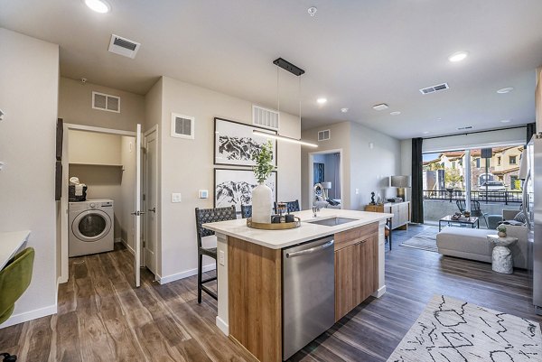 kitchen and laundry room at Aventine Littleton Apartments
