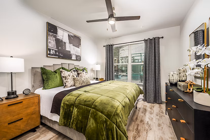 Spacious bedroom with elegant decor at The Aston at Town Center Apartments